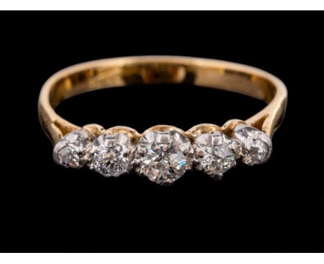 An 18 carat gold and diamond ring,: set with five old brilliant cut diamonds, approximately 0.40 carats total, stamped 18ct, 