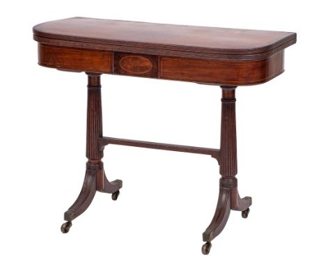 A Regency mahogany and inlaid card table:, bordered with boxwood and ebony lines, the baize lined hinged top with rounded cor