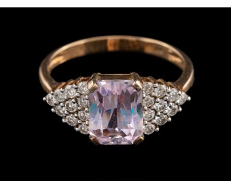 A kunzite and diamond ring:, the rectangular cut kunzite claw set between brilliant cut diamond set shoulders, stamped 9K, ri