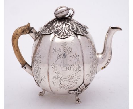 A Georgian silver teapot, all marks rubbed and worn, maker possibly William Reynolds ? Cork, circa 1780: monogrammed, of melo