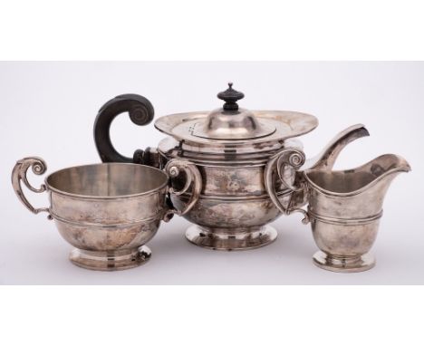 A Victorian silver three-piece tea service, maker Goldsmiths &amp; Silversmiths Co, London, 1897/98: of ovoid form with reede