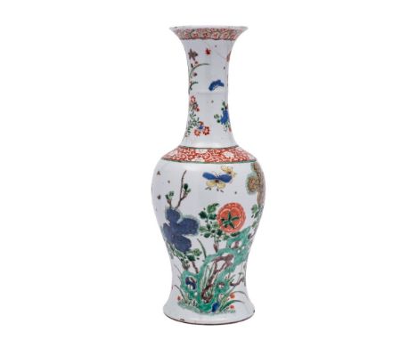 A Chinese famille verte yen-yen vase: the ribbed waisted slender neck with flared rim, painted with pierced green rockwork an