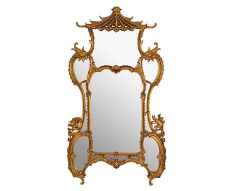 A contemporary gilt framed mirror in the Chinese Chippendale manner: the central arched panel and four oval foliate cartouche