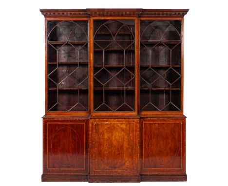 An early 19th Century mahogany and inlaid breakfront library bookcase:, crossbanded in satinwood, bordered with boxwood and e