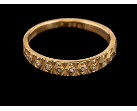 A 1970s 18 carat gold and diamond ring,: the half textured band set with eight cut diamonds, stamped 750 with full Birmingham
