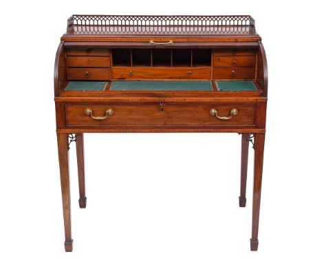 An early 19th Century mahogany and inlaid cylinder tambour-fronted writing desk:, crossbanded in rosewood, bordered with boxw