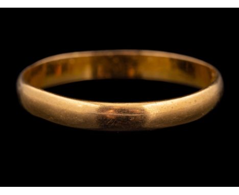 A 22 carat gold ring,: the polished band stamped 22 with full Birmingham hallmarks for 1960, ring size V, 2.7g.