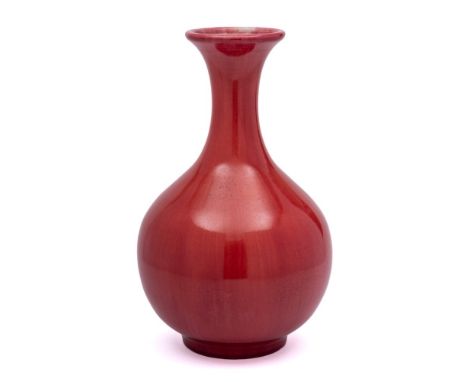 A Pilkington's Royal Lancastrian pottery vase: of oviform with raised flaring neck and under streaky red glazes, impressed ma