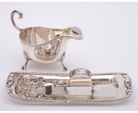 A George IV silver candle snuffer, maker Thomas Radcliffe, London, 1826: of scissor action with shell decoration, 18cm long, 