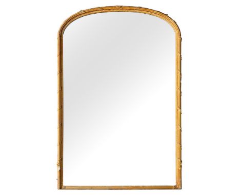 A Victorian carved and gilt composition arch topped overmantel mirror, mid 19th century,: with ribbon tied reeded surround; a