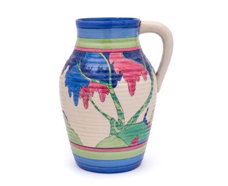 A Clarice Cliff Bizarre Lotus jug: painted in the Rudyard pattern of a continuous landscape, one side with a large tree with 