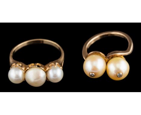 A cultured pearl and diamond-set crossover ring,: each cultured pearl set with a single diamond, ring size K 1/2; together wi