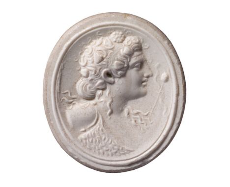 An oval glass paste portrait medallion of Dionysus attributed to James Tassie: late 18th century, 3.5 x 3cm framed.