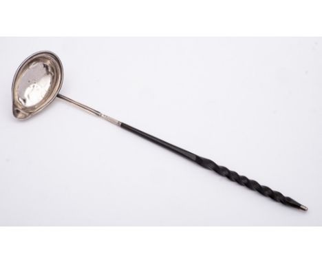 A George III silver and baleen punch ladle, maker Josiah Snatt, London, 1801: the bowl of oval outline, with curved lip to on