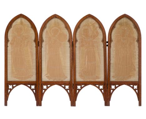 An oak four fold dwarf screen in the Gothic taste:, the pointed arch panels each with an embroidered figure of an angel playi
