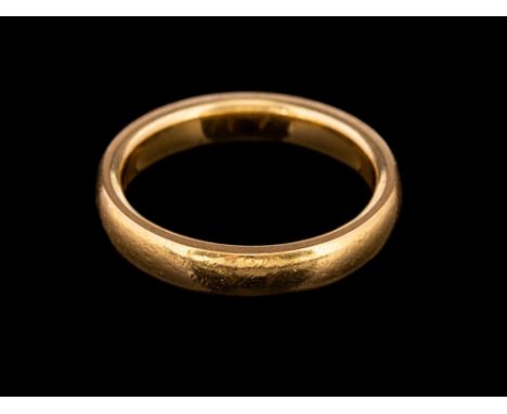 A 22 carat gold ring,: the plain polished band, stamped 22 with full Birmingham hallmarks, ring size L, 6g.