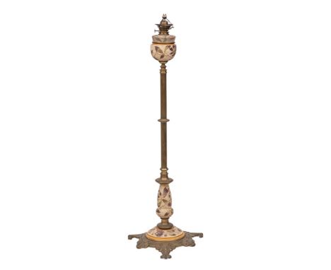 A brass and Doultonesque pottery adjustable column standard lamp:, the reeded column surmounted by a pottery oil font of Slat