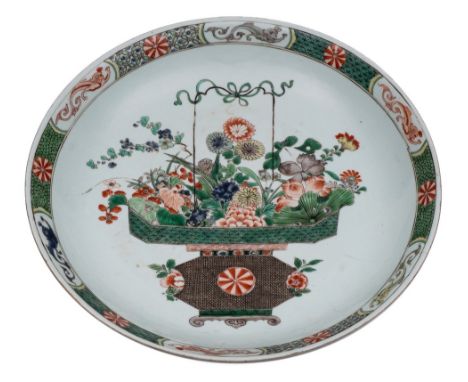 A Chinese famille verte 'basket of flowers' charger: finely enamelled with a large basket of flowers and foliage within a rim