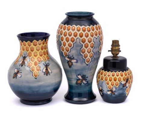 Two Moorcroft pottery vases and a matching lamp: each tube lined in the Honeycomb pattern after a design by Phillip Richardso