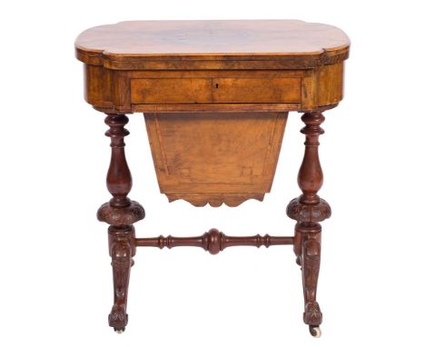 A Victorian walnut and inlaid games and work table:, crossbanded in tulipwood, bordered with boxwood lines, the quarter venee