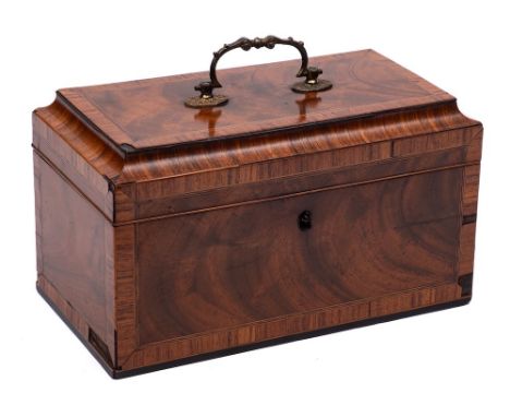 A George III mahogany and kingwood crossbanded tea caddy: of rectangular outline with shallow domed hinged lid enclosing thre