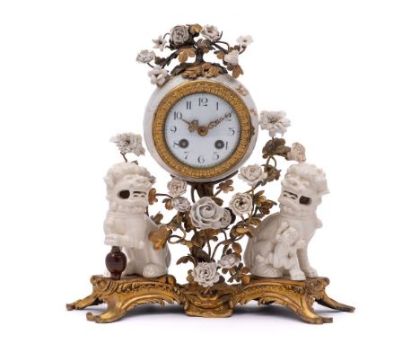 A Louis XV-style ormolu-mounted and blanc-de-chine porcelain mantel clock: with white enamel dial, the barrel shaped movement