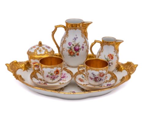 A K.P.M. Berlin porcelain tête à tête: comprising a tray, coffee pot, milk jug, sugar box and cover, two cups and two saucers