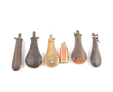 Embossed brass shot flask, 18cm, a copper shot flask, 12cm, and four other powder pouches, two in stitched leather, the large