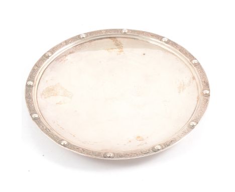 A circular silver waiter, Wakely &amp; Wheeler, London 1948, Celtic style rim, on raised circular foot, 20cm, approx. 9.5oz.