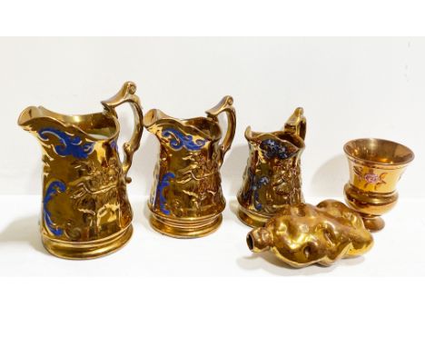 Collection of copper lustre jugs and related items, including an unusual organic form flask, 16cm.