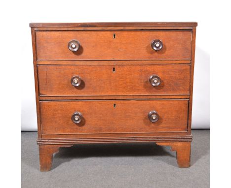 Small Victorian oak chest of drawers, rectangular top with reeded edge, fitted with three long graduating drawers with turned