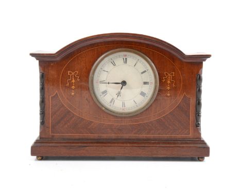 Edwardian mahogany mantel clock case, domed top, the white circular dial flanked by inlaid bows and box strung outlines, repl