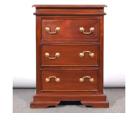 Contemporary hardwood three drawer chest, of small size, rectangular top with moulded edge, three long drawers, moulded brack