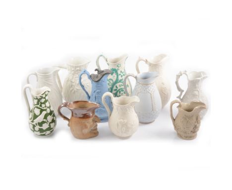 Eleven assorted Victorian decorative jugs, including a William Brownfield International allegorical jug, the body moulded in 