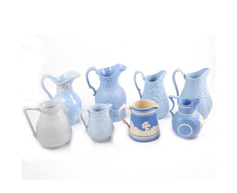 Eight assorted Victorian relief-moulded decorative jugs, including a Copeland Jasperware Hunting jug, tapering body, 13cm; a 