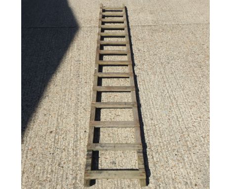 An early 20th century wooden barn ladder, 350cm