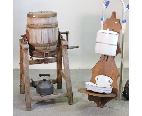 An antique painted wooden butter churn on stand, together with an oak wall mounted washstand, with enamel fittings