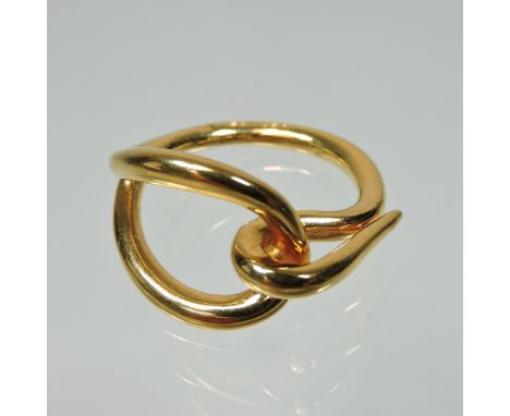 A Hermes 18 carat gold designer ring, of openwork design, stamped marks, boxed