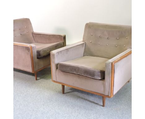 A pair of 1970's brown upholstered button back armchairs