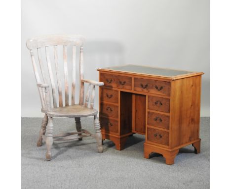 A yew wood pedestal desk, 91cm, together with a stick back chair