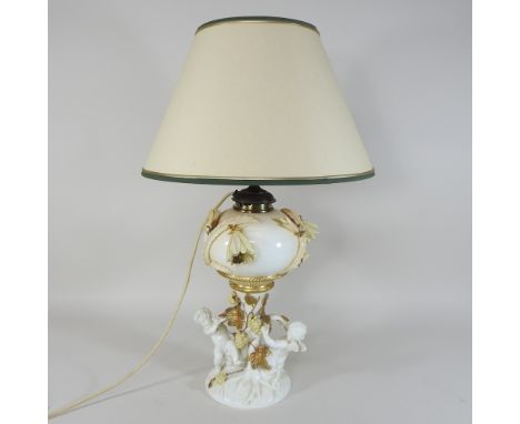 A 19th century Moore style white glazed porcelain oil lamp, 60cm high