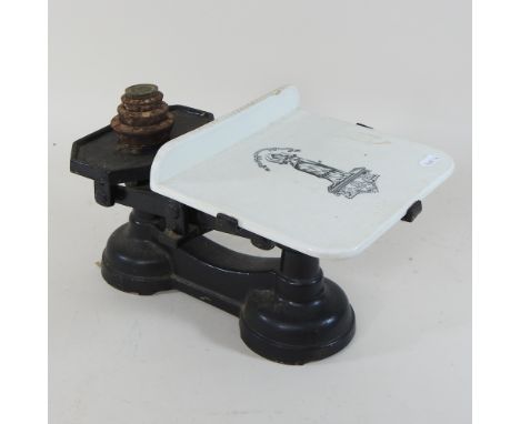 A set of white enamel kitchen scales, 38cm