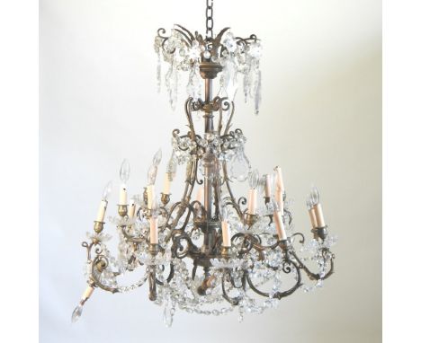 An early 20th century brass chandelier, with cut glass drops, 90cm high