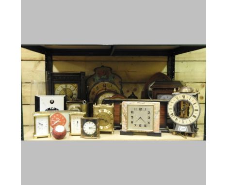 Two shelves of clocks to include an Edwardian mantel clock and an Art Deco mantel clock, together with an oak barometer and a