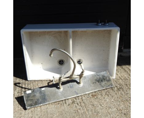 A ceramic double butler's sink, 90cm, together with a pair of taps, on a marble plinth, 85cm