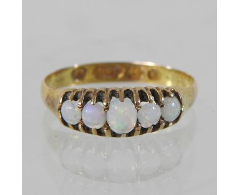 A 15 carat gold opal five stone ring