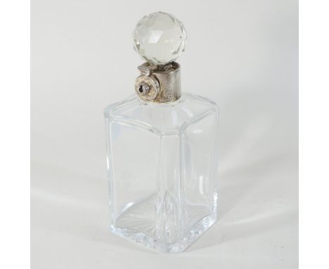 An early 20th century silver mounted glass decanter and stopper, with a lockable silver collar, Birmingham 1929, 24cm high