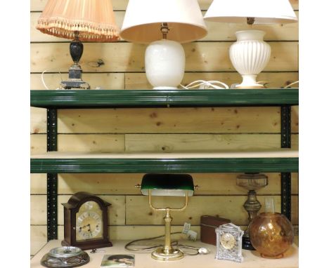 A brass desk lamp, 37cm high, together with three table lamps, an oil lamp, clocks and other items