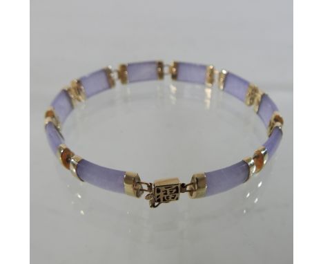 A 10 carat gold lavender jade bracelet