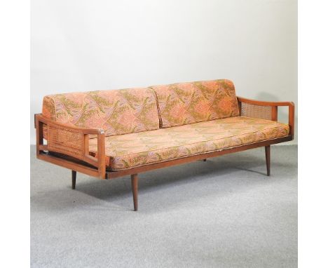 A 1960's teak sofa, with loose cushions, 195cm